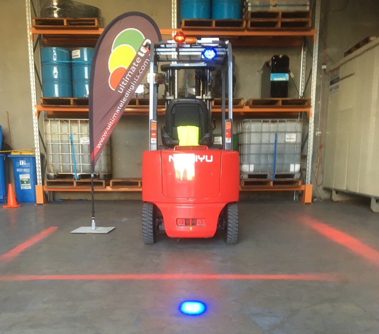 Blue spot and red zone warning lights fitted to a forklift