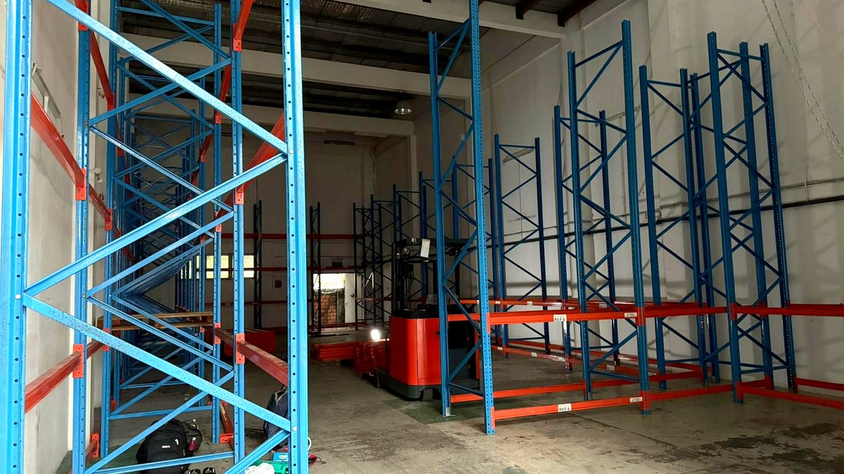 Empty Singapore warehouse unit with bare floor and standing racking